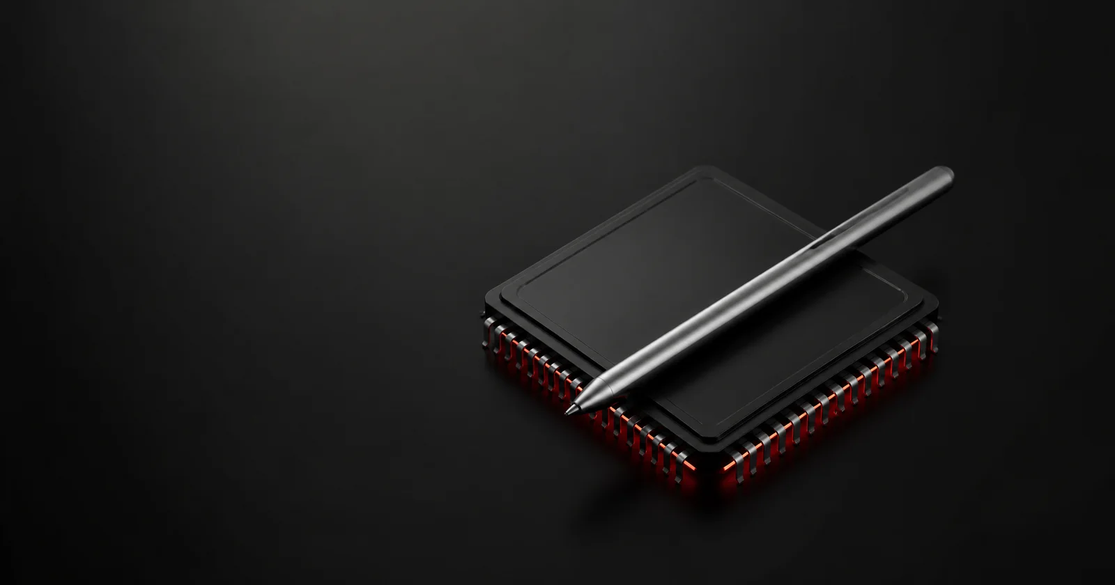 A black processor chip with a red glow and a silver stylus resting on it.
