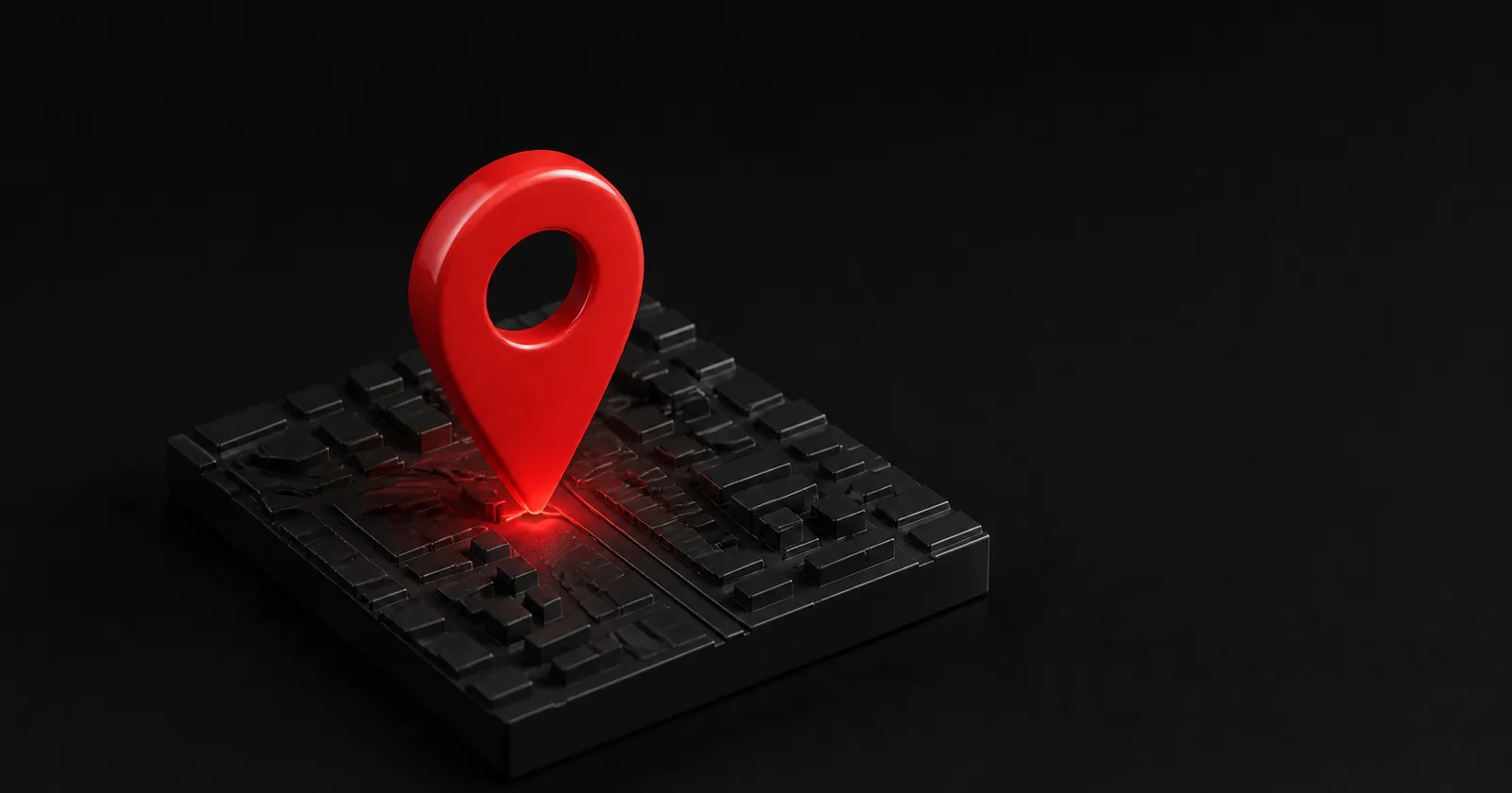 A glossy red map pin standing on a black 3D model of city blocks.