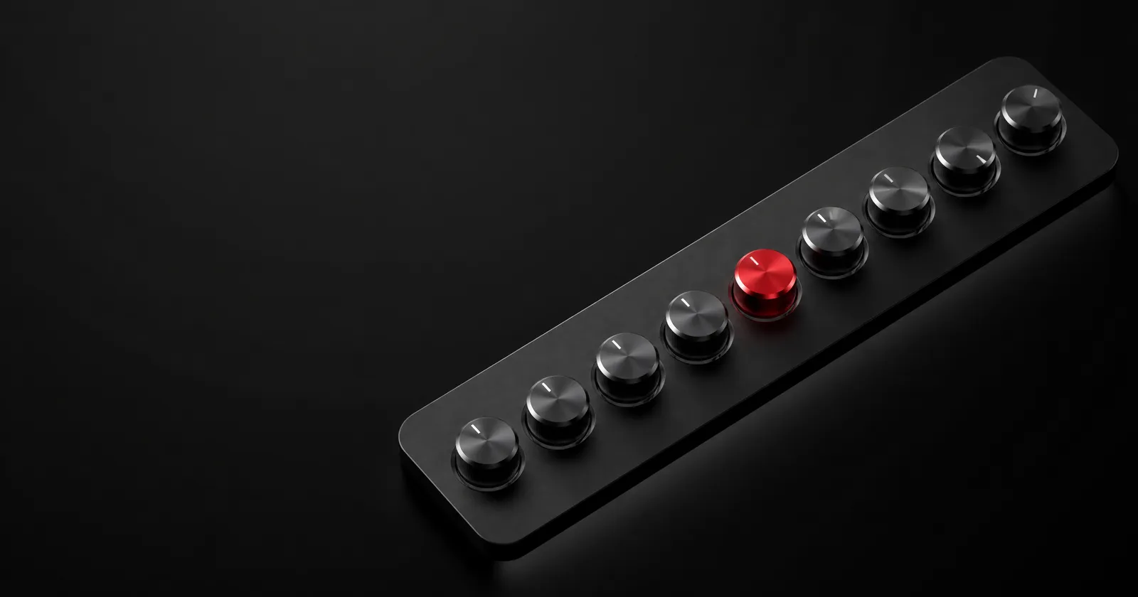 A black control panel with nine metal dials at different settings, one of them red.